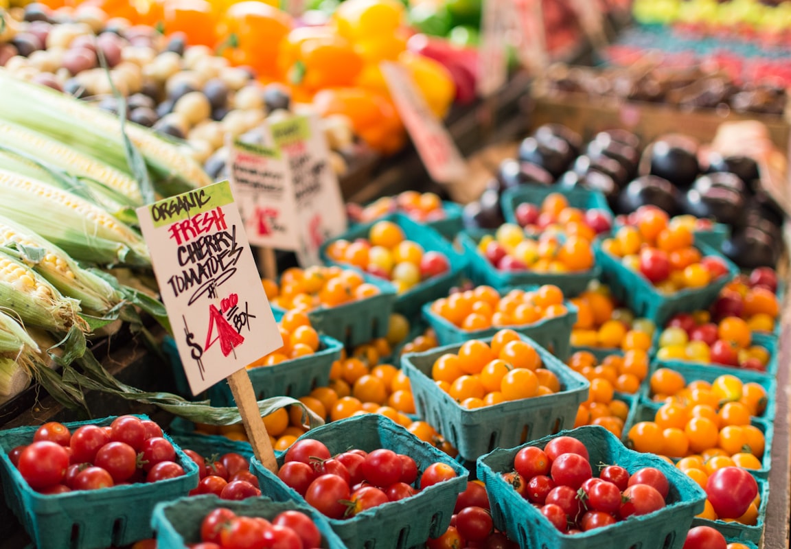 Fresh seasonal vegetables and whole foods in a sustainable kitchen setup